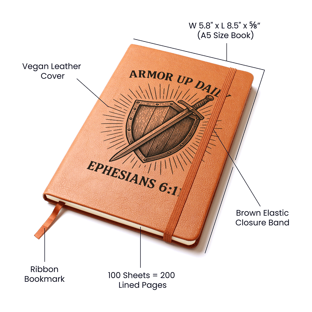 Brown leather prayer journal engraved with a shield and sword design and the words “Armor Up Daily – Ephesians 6:11.”
