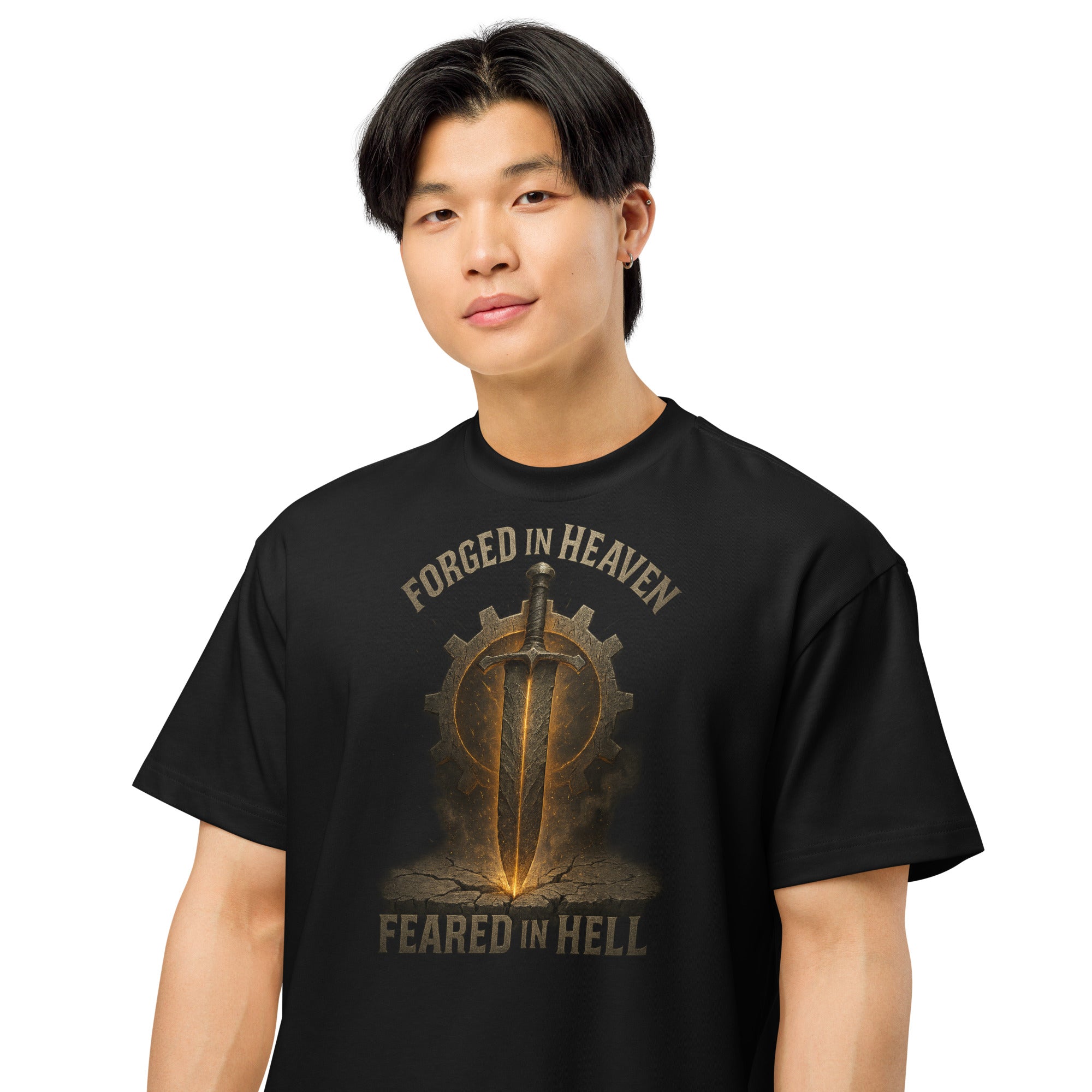 Black men’s box tee with bold sword and gear graphic, featuring the words Forged in Heaven, Feared in Hell.