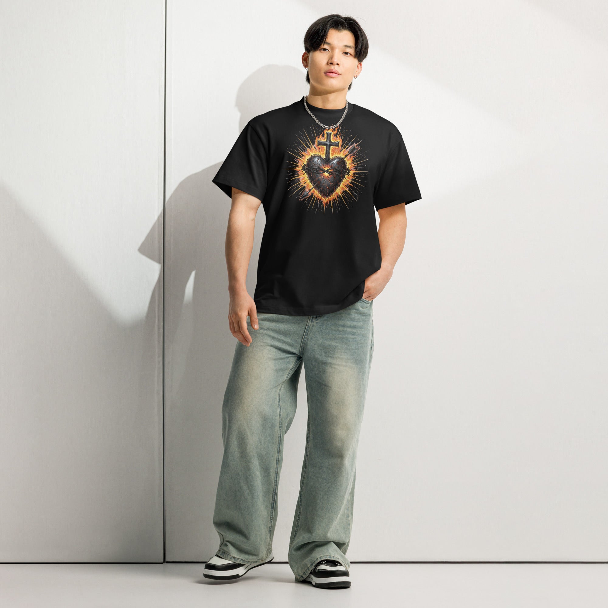 Black men’s box tee with a fiery Sacred Heart of Jesus graphic and cross, designed on Cotton Heritage MC1087.