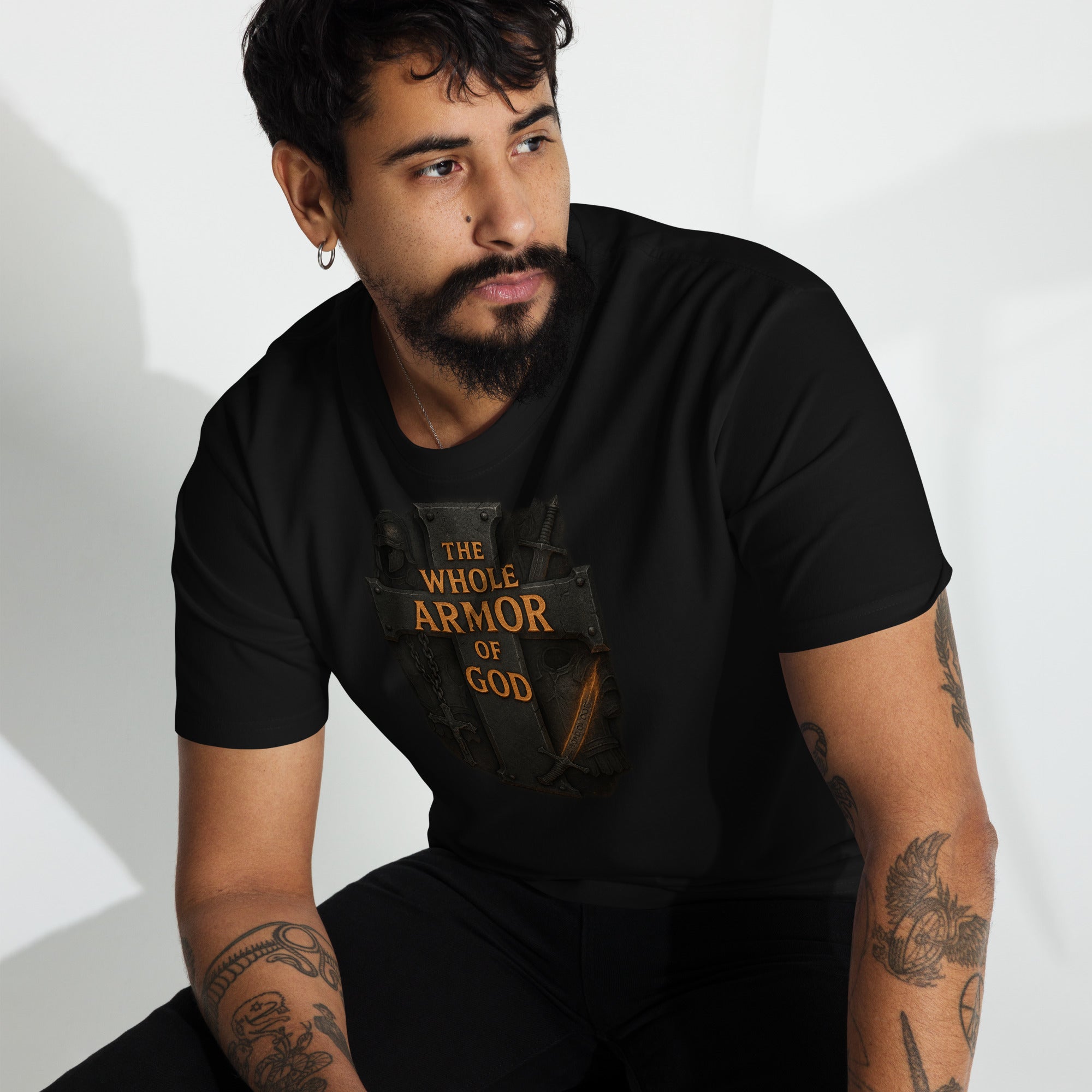 "Men’s black premium t-shirt with medieval cross and weapons design featuring the text ‘The Whole Armor of God’"