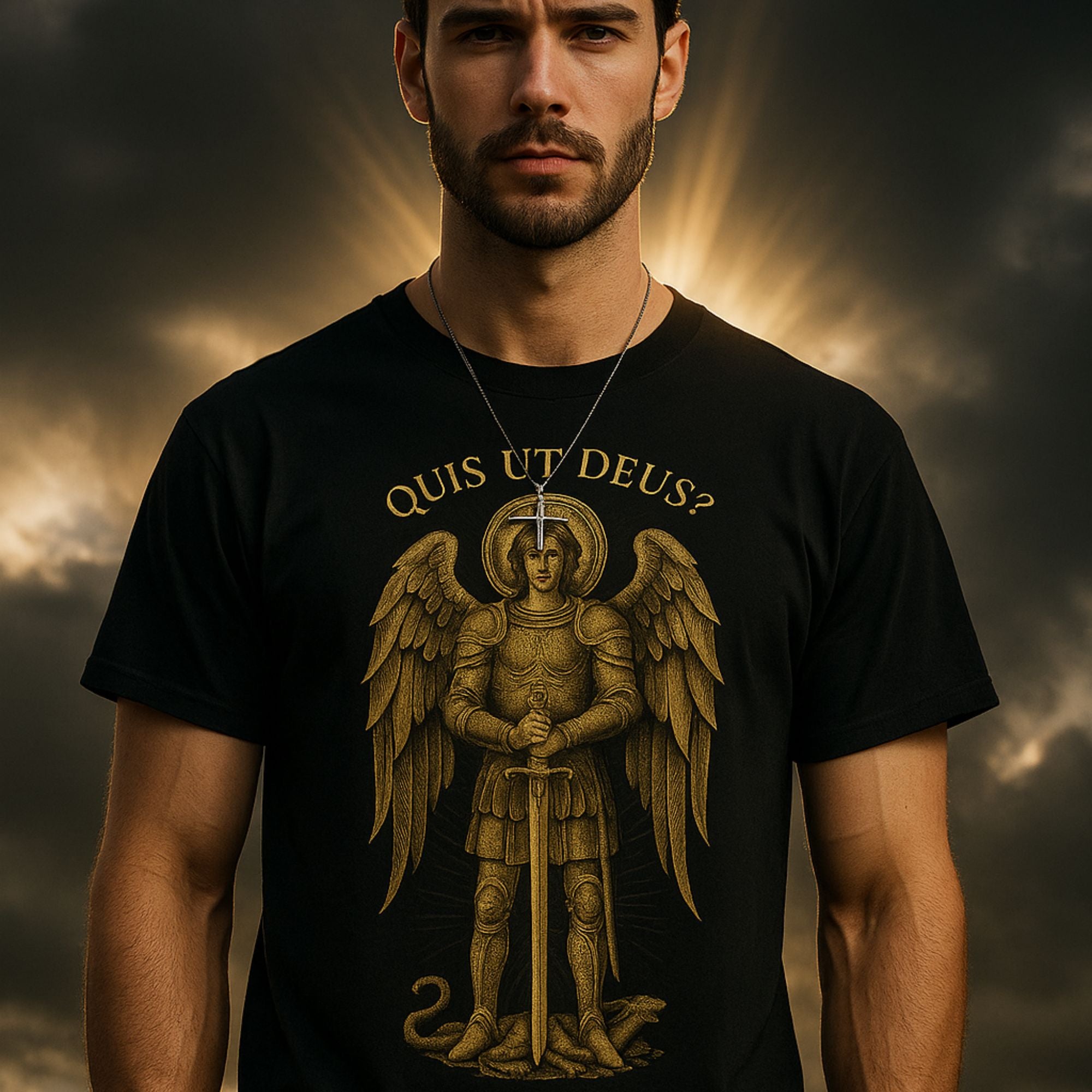 Man wearing a black t-shirt with an angel graphic and 'Quis ut Deus?' text against a dramatic sky.